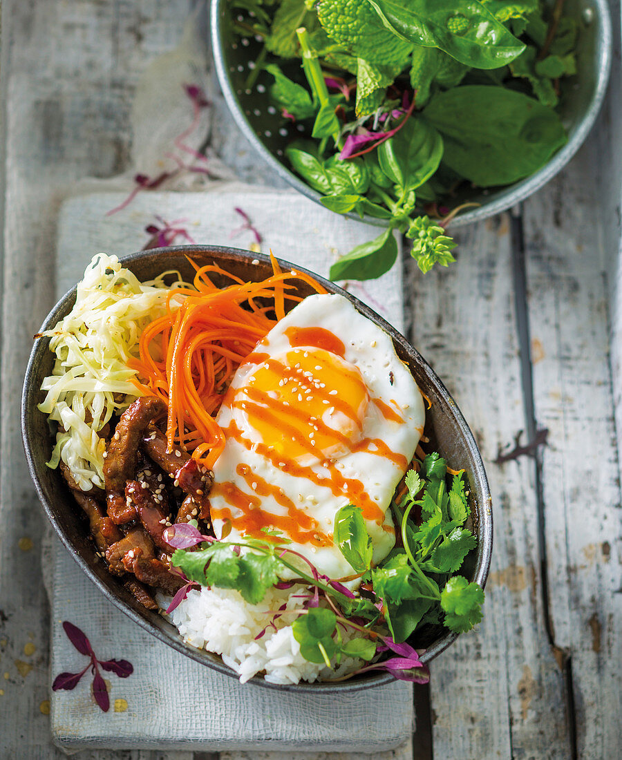 Bibimbap bowl with beef and egg