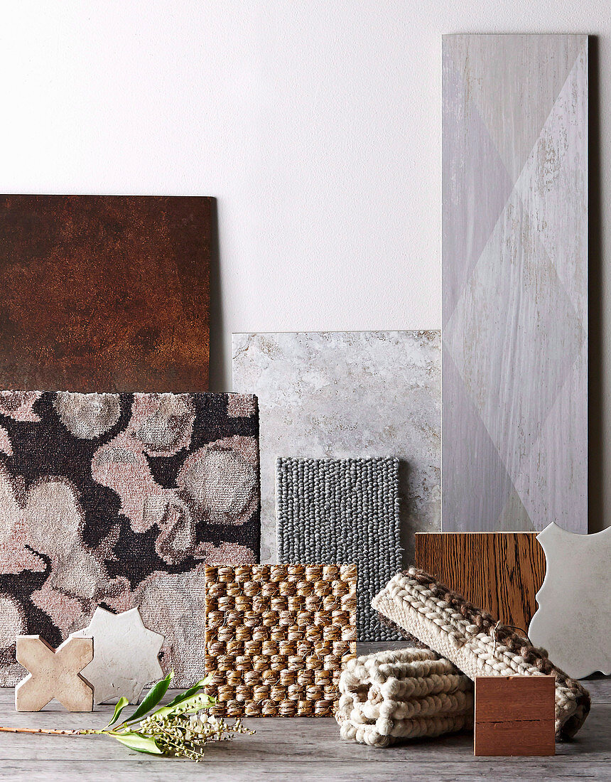 Different floor coverings in gray and natural tones