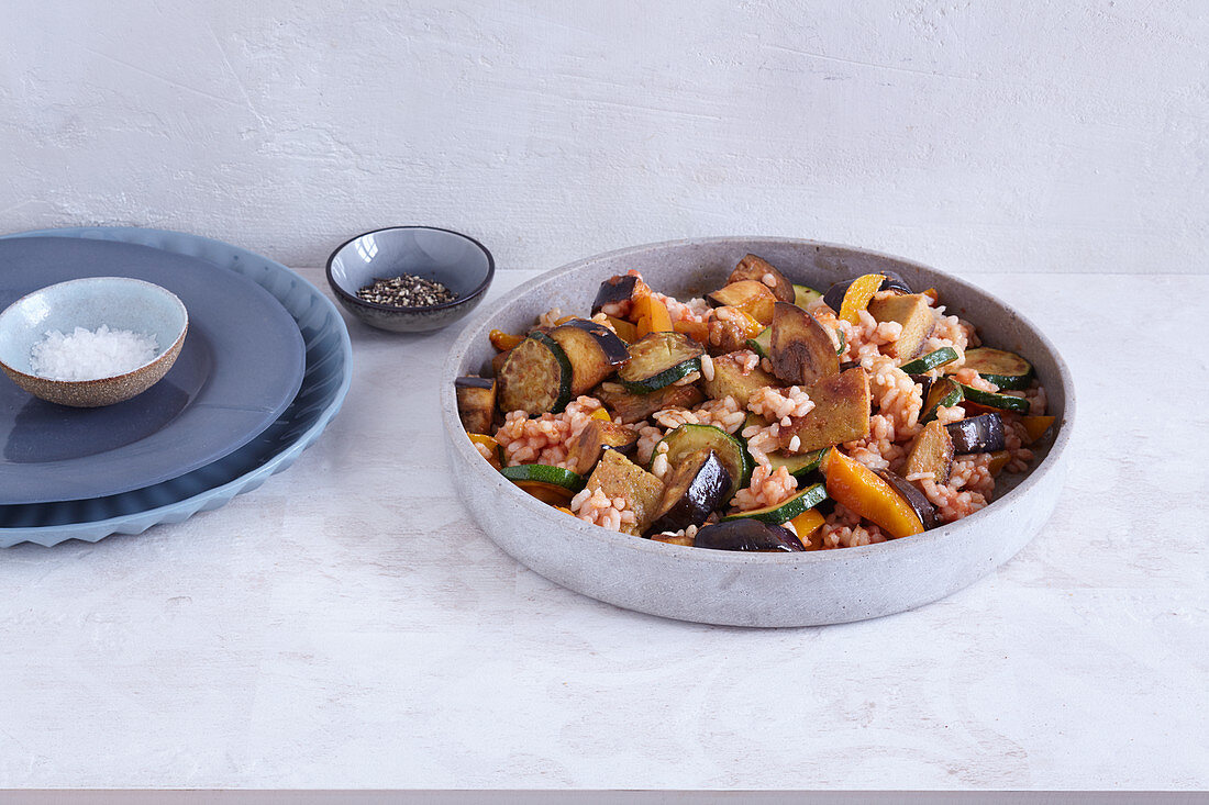 Colourful vegetable paella with lupine fillets