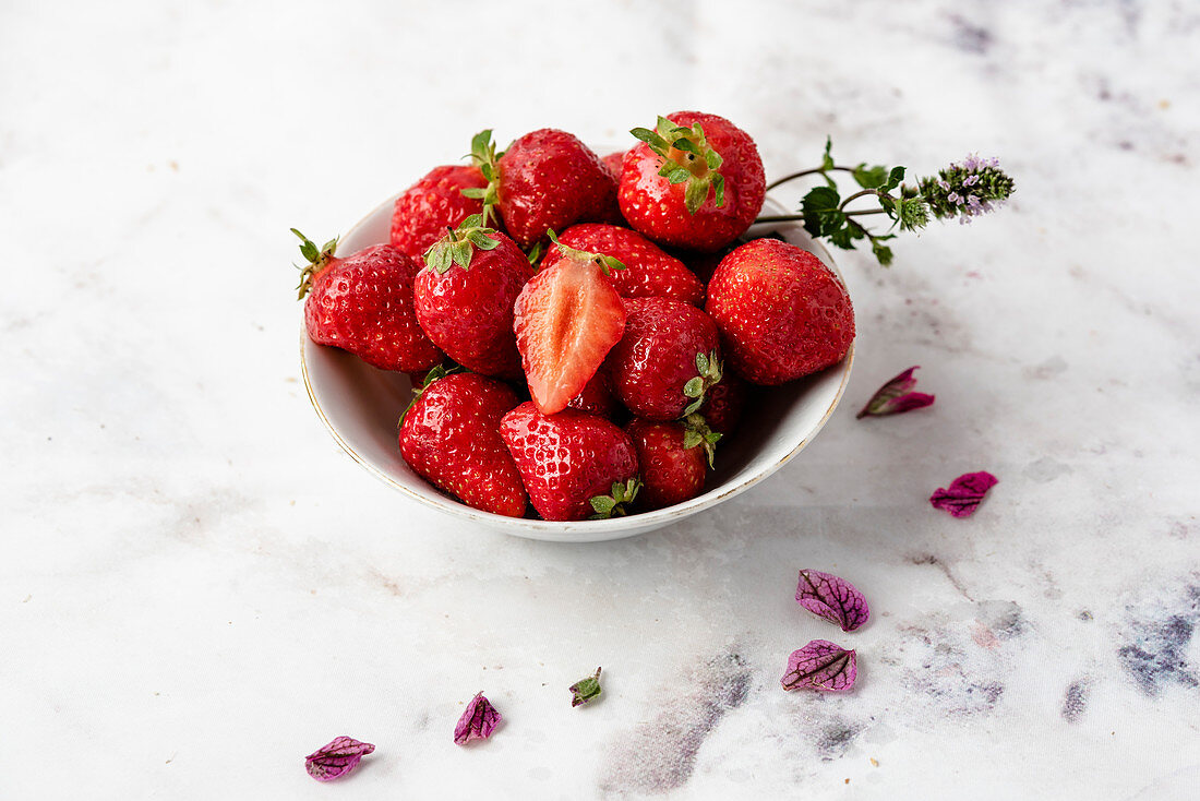Fresh strawberries in a small bowl