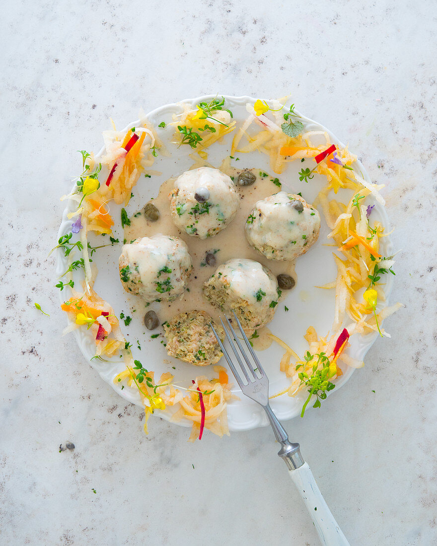 Vegetarian grain dumplings with a caper sauce