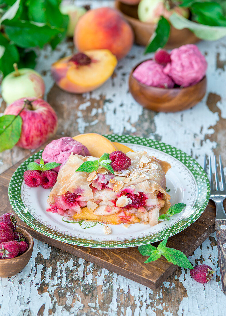 Fruit strudel with peaches, apples and raspberries
