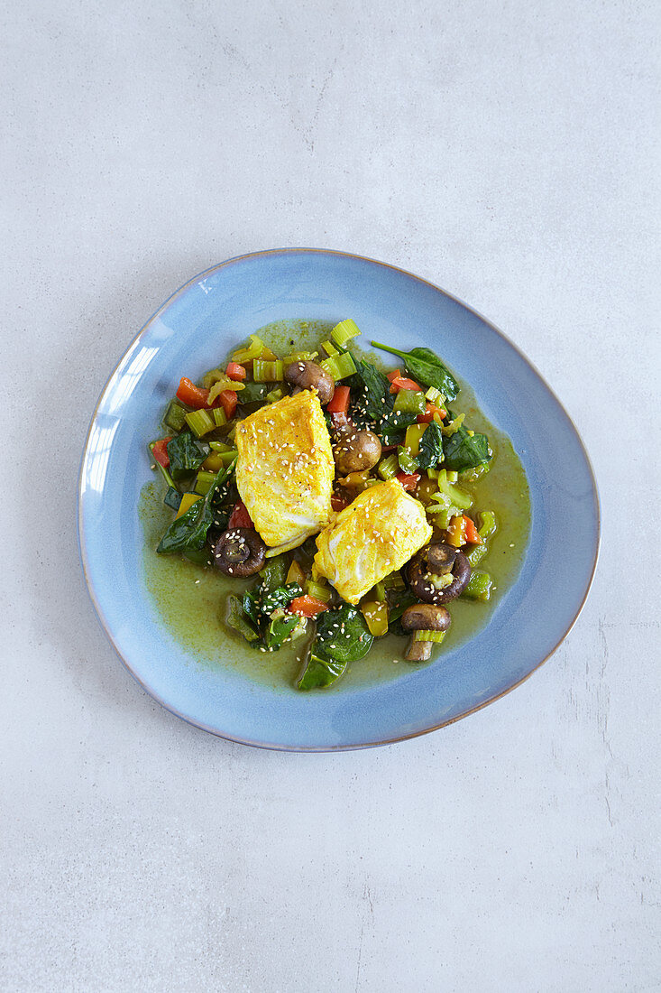 Fish with colourful vegetables made in a tagine