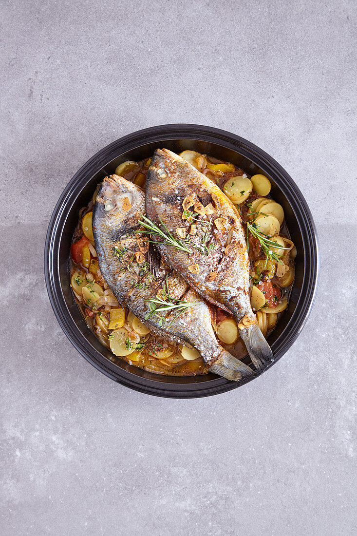 Seabream with a pepper and potato medley made in a tagine