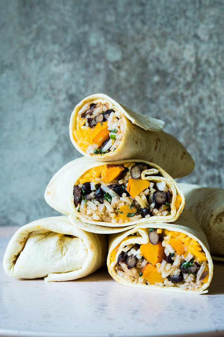 Mexican burritos with pumpkin, cheddar and black beans