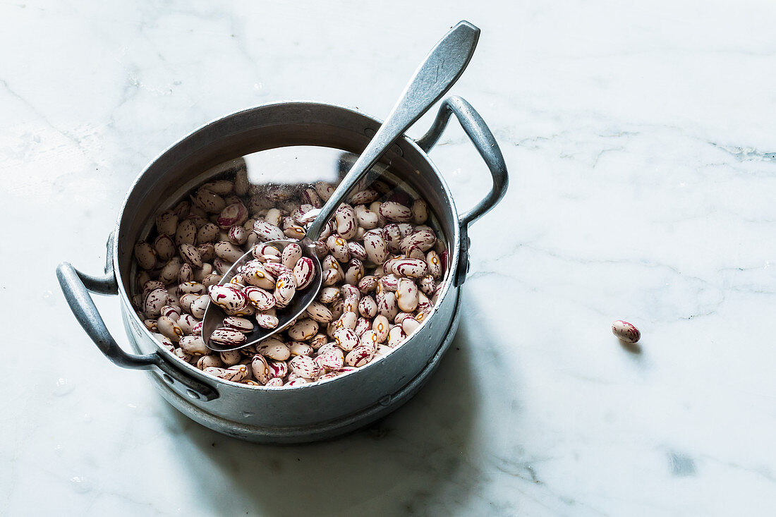 Beans being softened in water