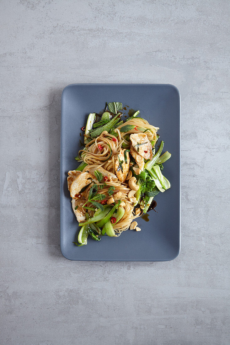 Stir-fried spicy rice noodles with chicken and bok choy