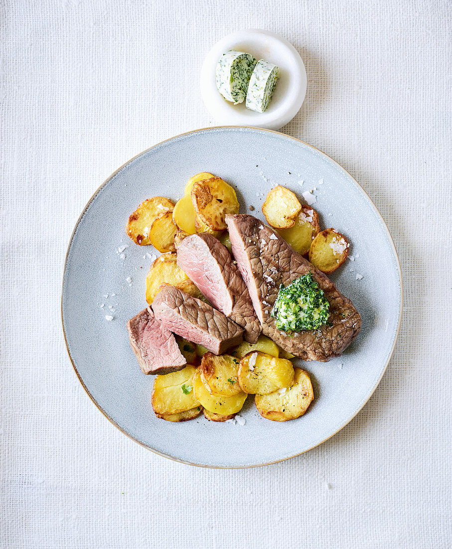 Rump steak with fried potatoes made in a hot-air fryer