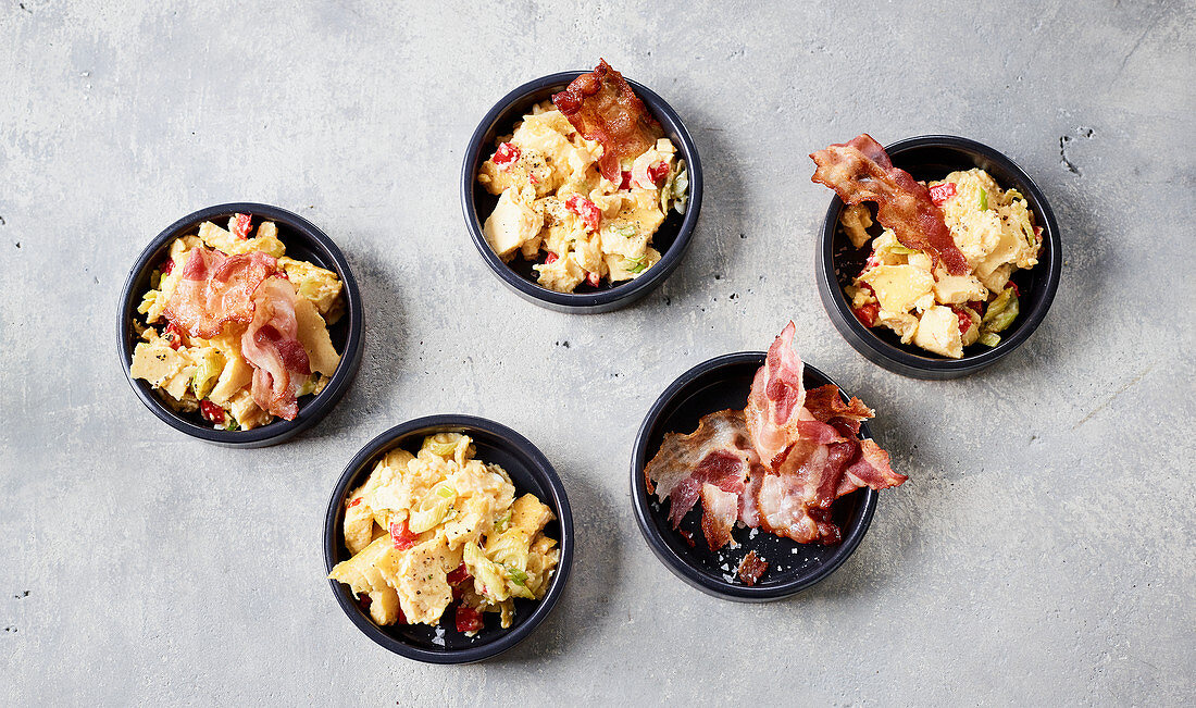 Scrambled eggs with bacon made in a hot-air fryer