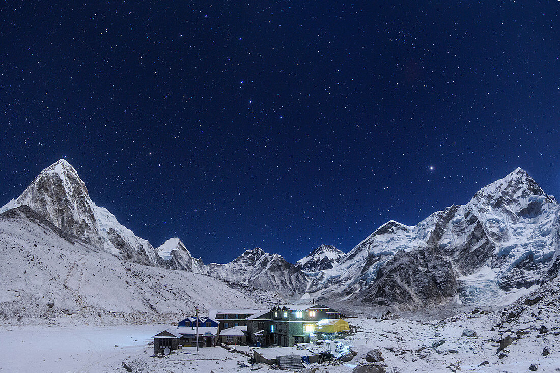 Night sky above Himalayas and Nepalese village