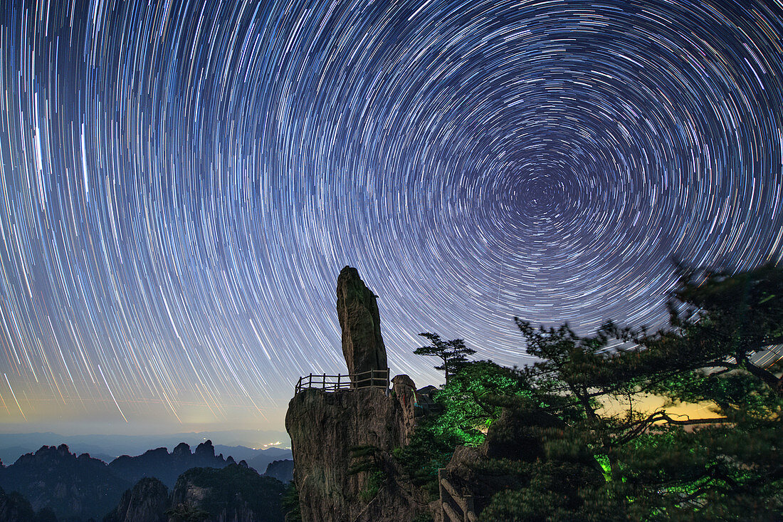 Star trails over Flying-Over Rock, time-exposure image