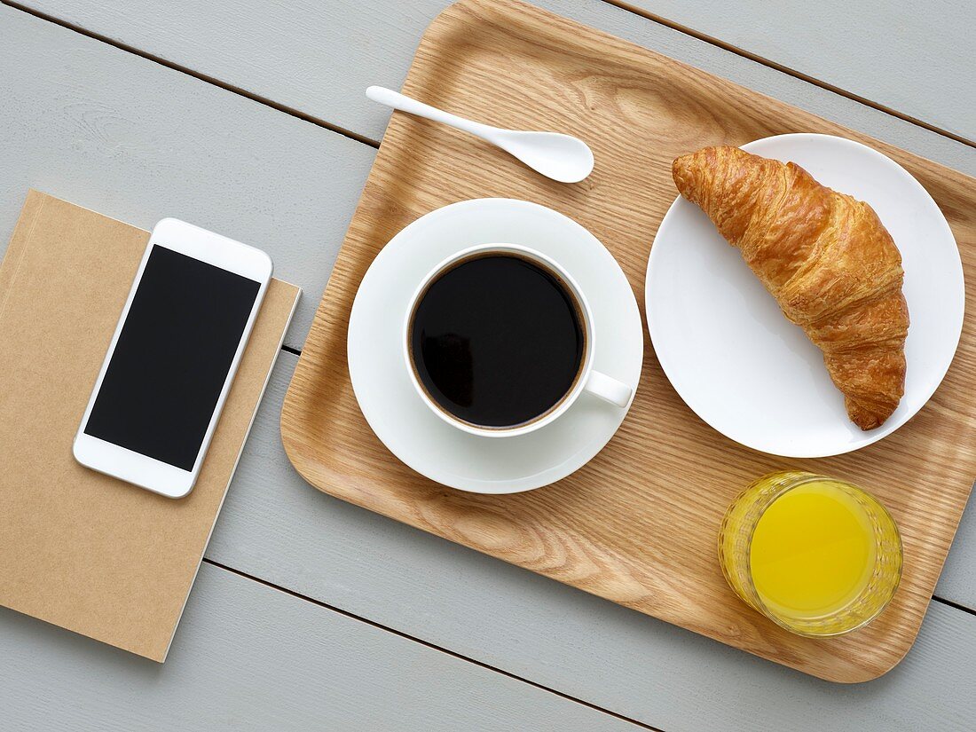 Breakfast tray and smartphone