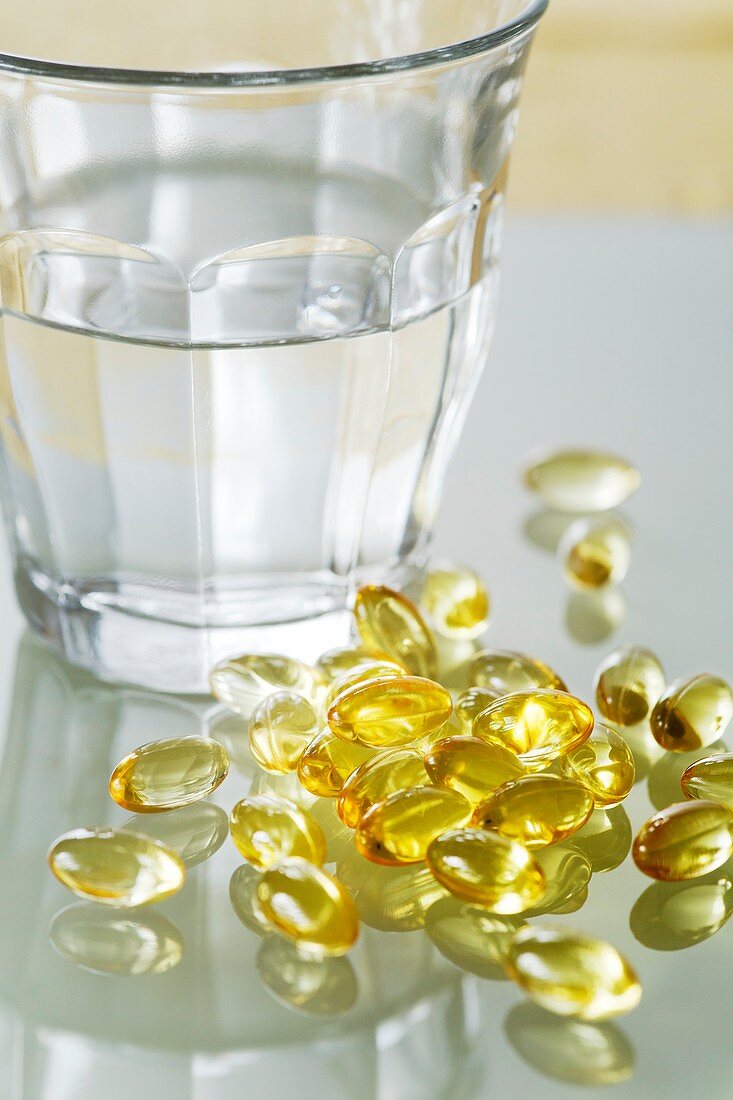 Evening primrose oil capsules and water