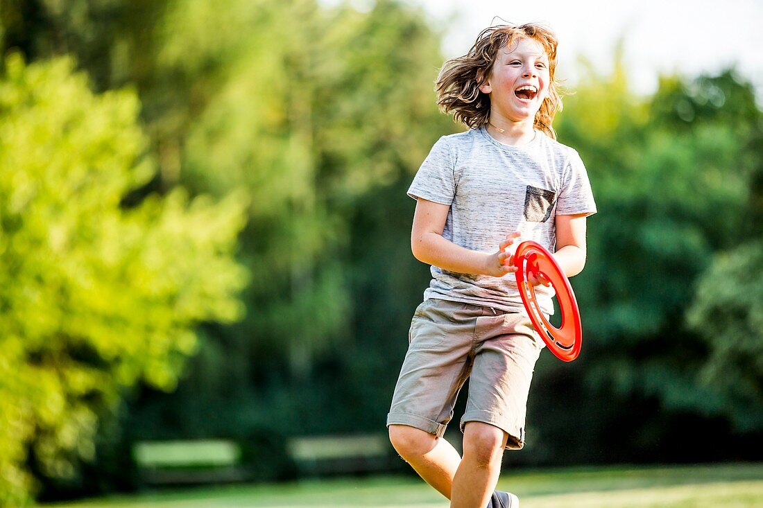 Boy playing with flying disc