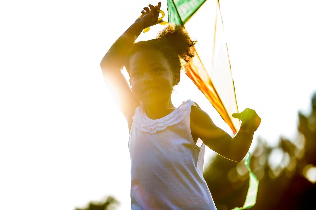 Girl holding kite
