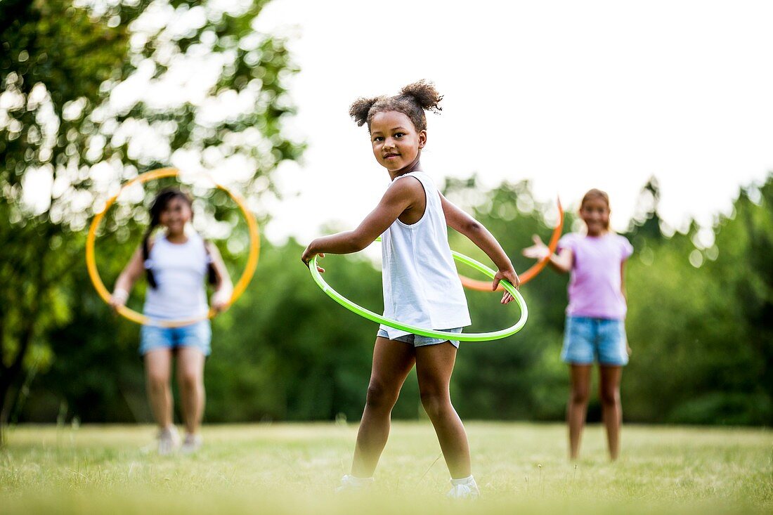 Girls playing with hula hoops