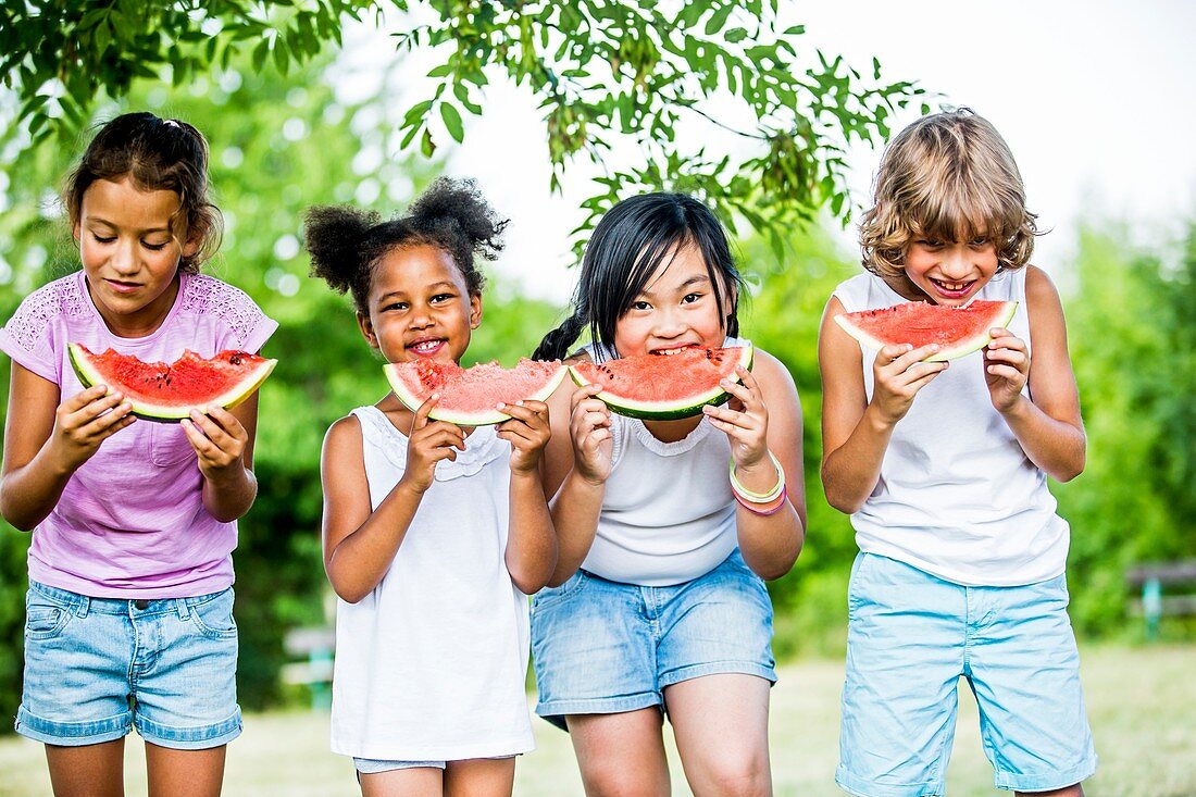 Children eating watermelon