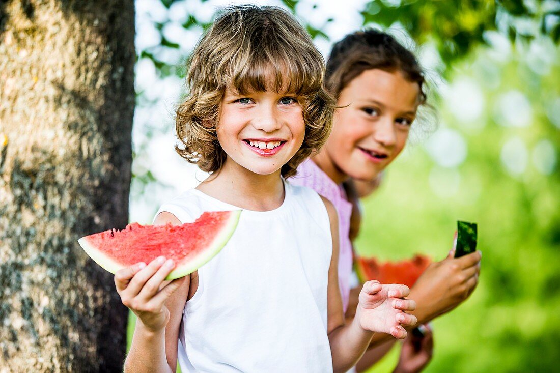 Children eating watermelon