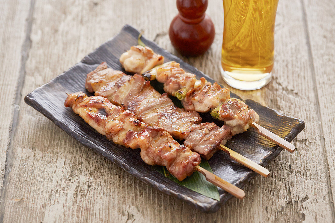 Yakitori skewers with a beer