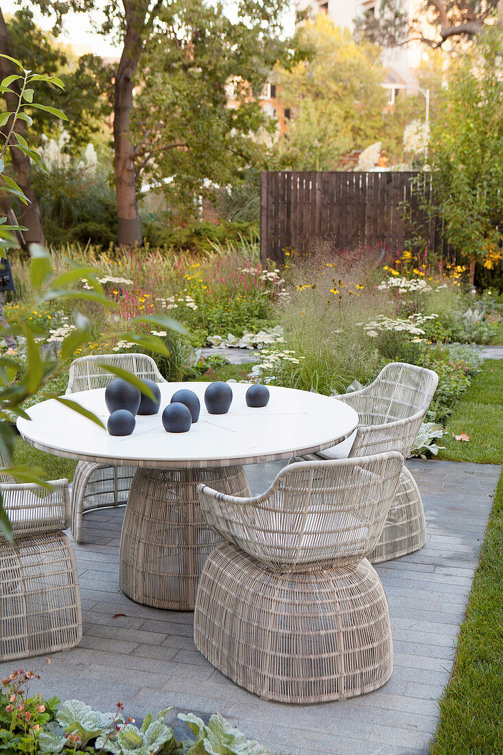 Round table with chairs in the garden