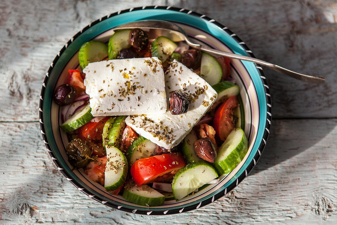 Greek salad with feta, cucumbers, tomatoes and olives