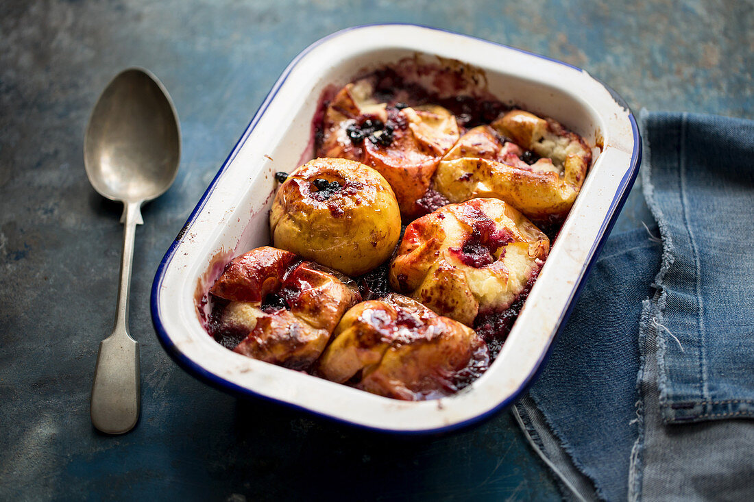 Baked apples with blueberry jam and custard