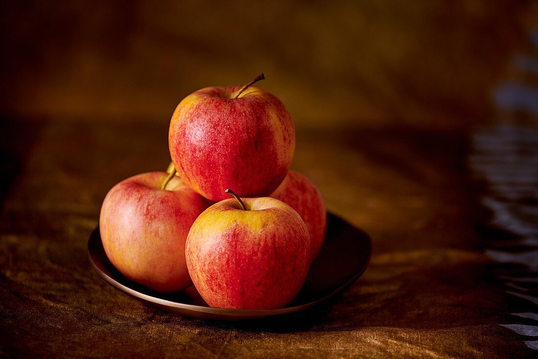 Red apples on a plate