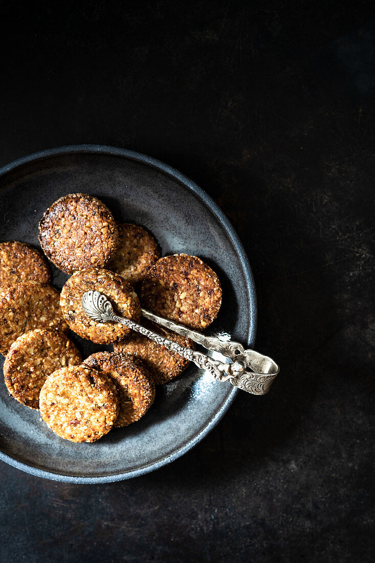 Spiced biscuits with walnuts, dates and coconut flakes