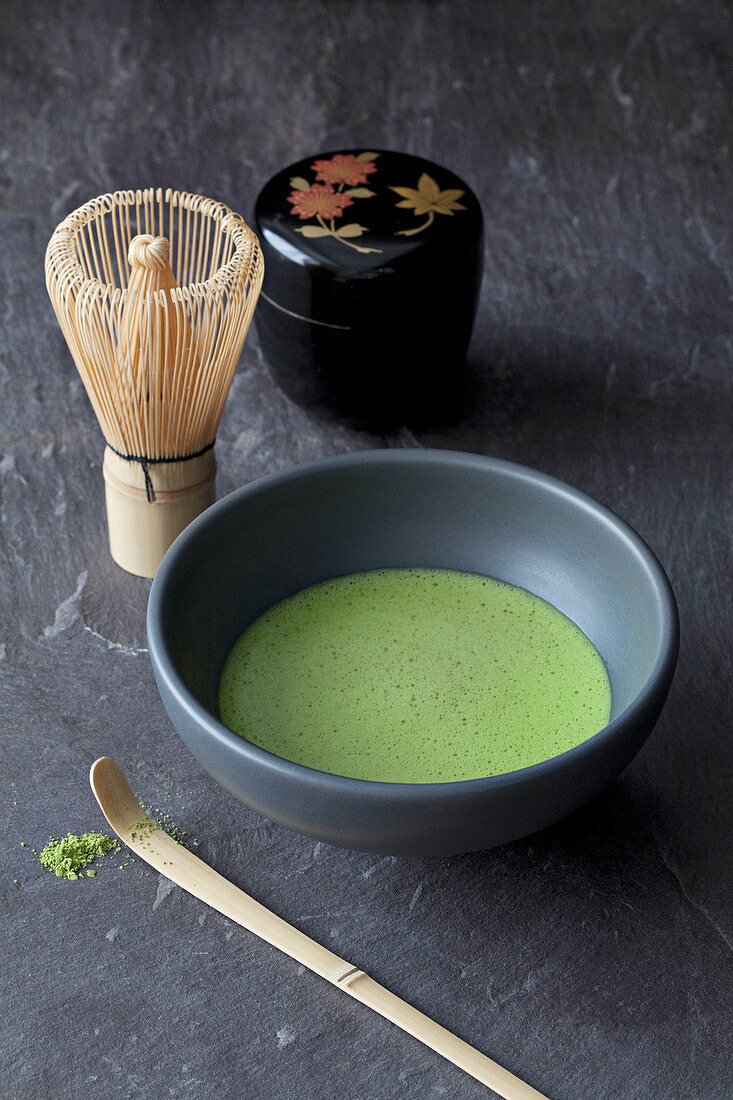 Matcha tea and whisk