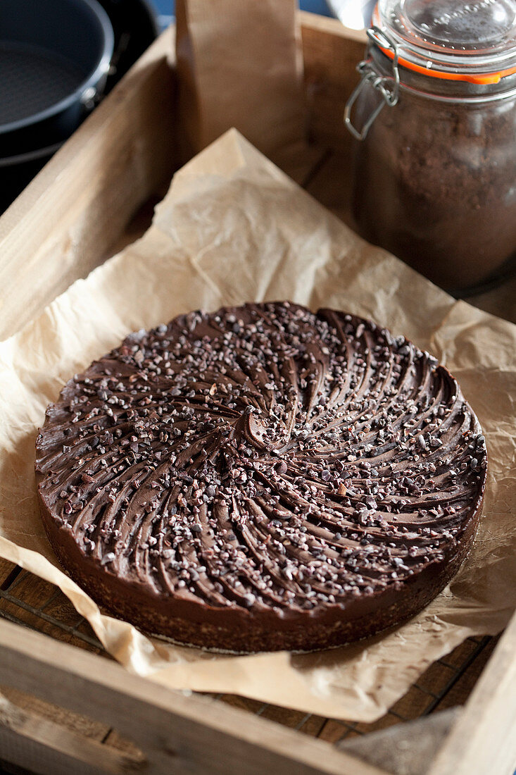 Beautifully decorated chocolate torte in a vintage tray