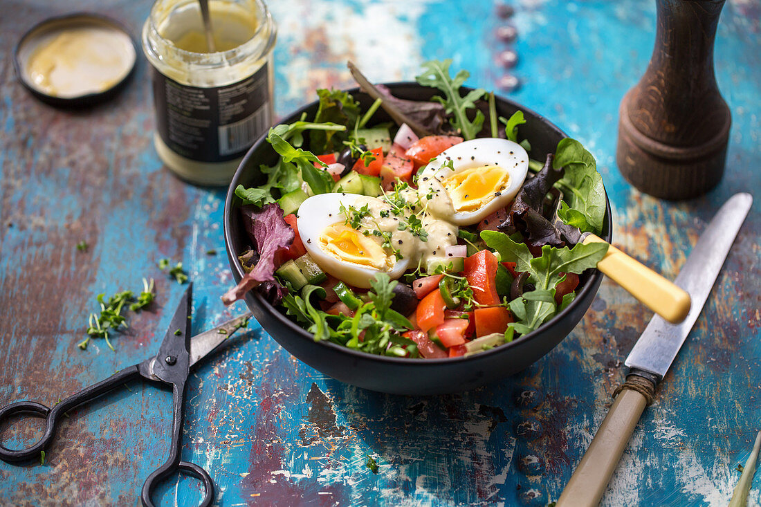 Summer alad with micro herbs, duck egg and olives