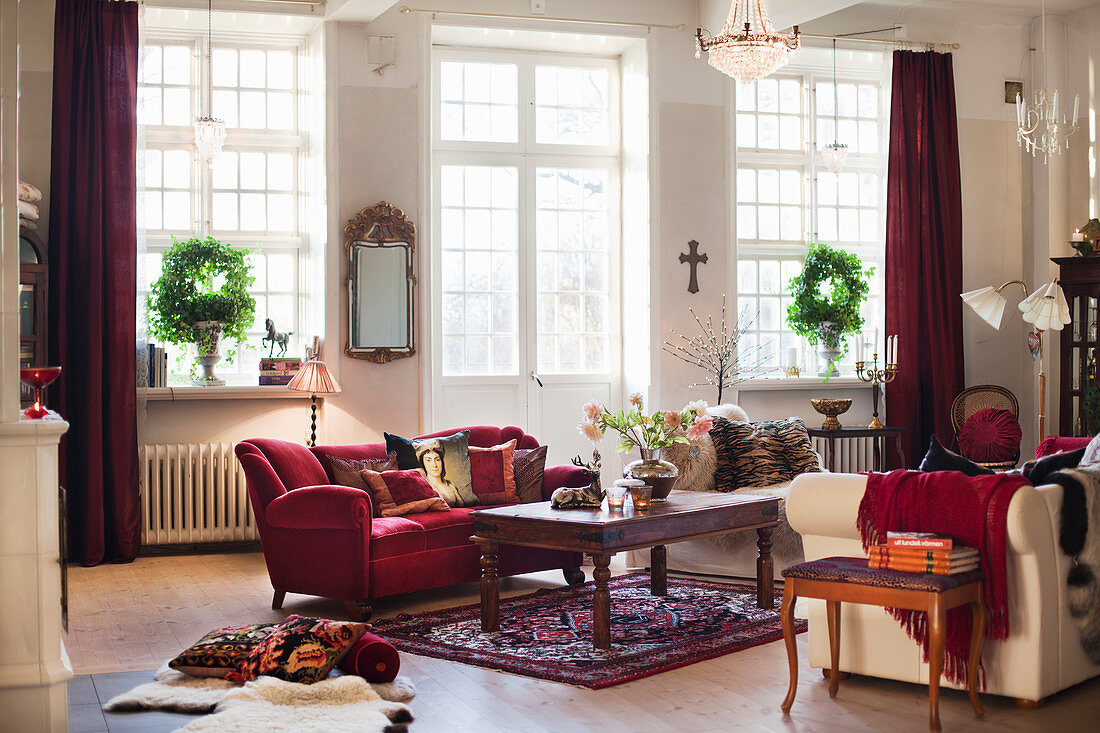 Sofas and coffee table in period living room with lattice window