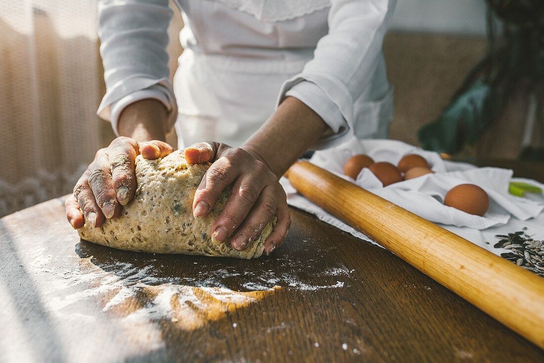 Woman Preparing Homemade Dough in the Kitchen