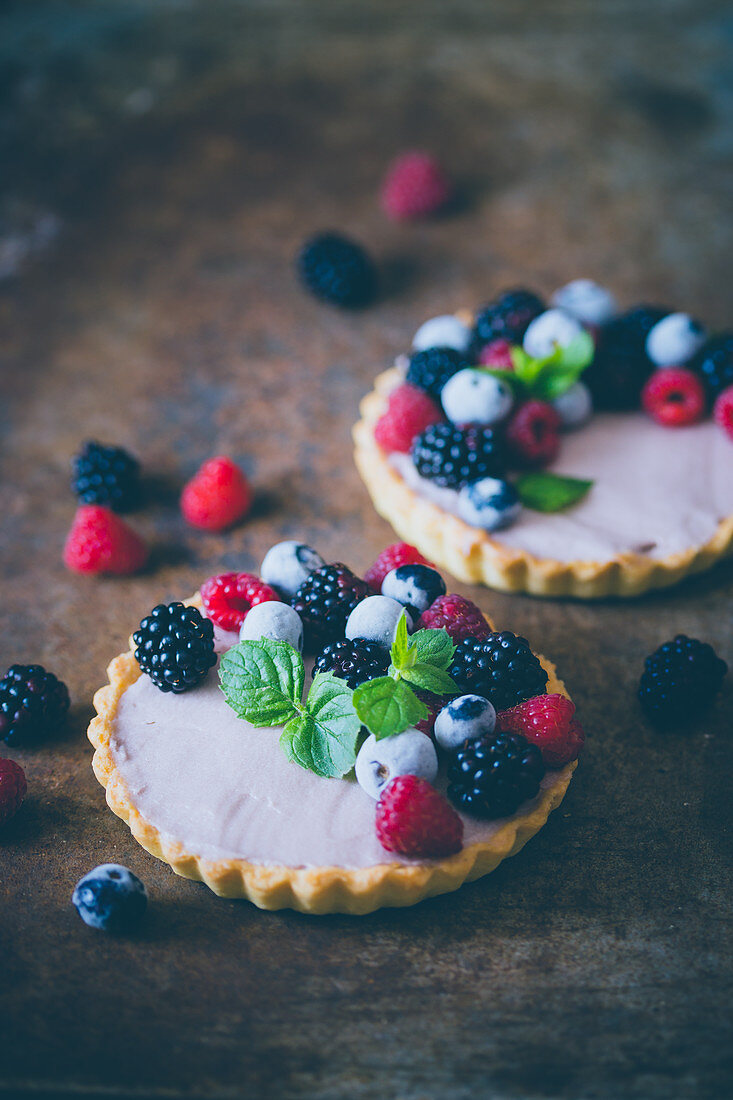 Mini tarts with custard and berries