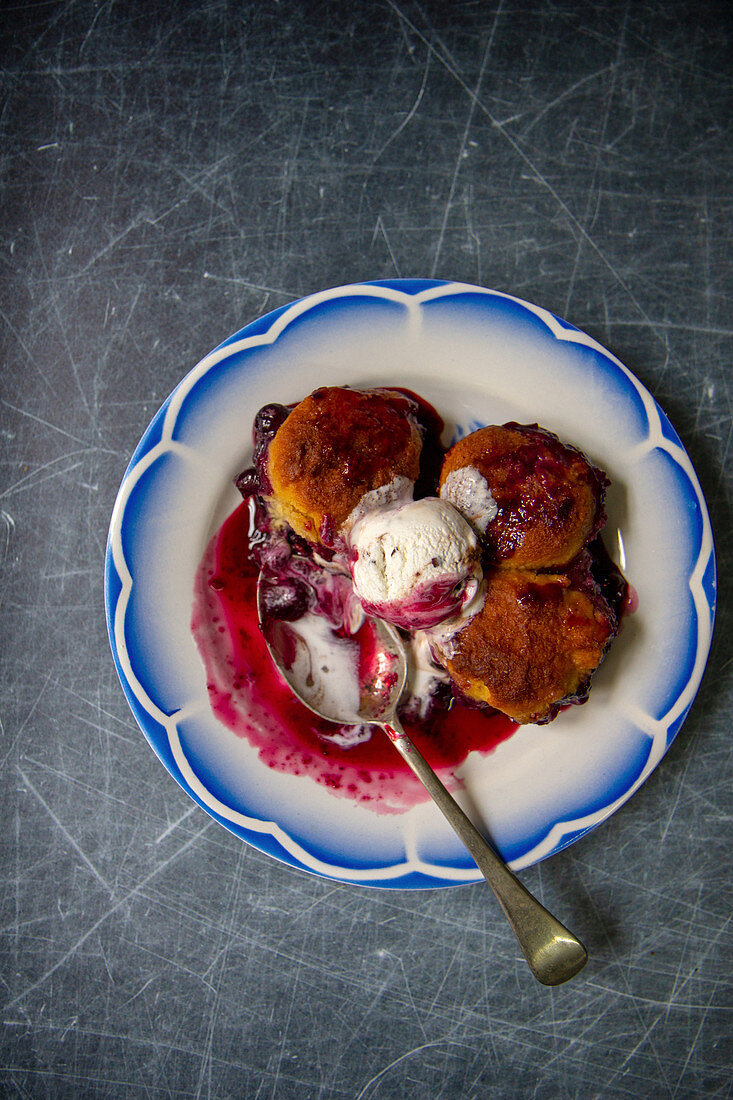 Cobbler with berries and ice cream