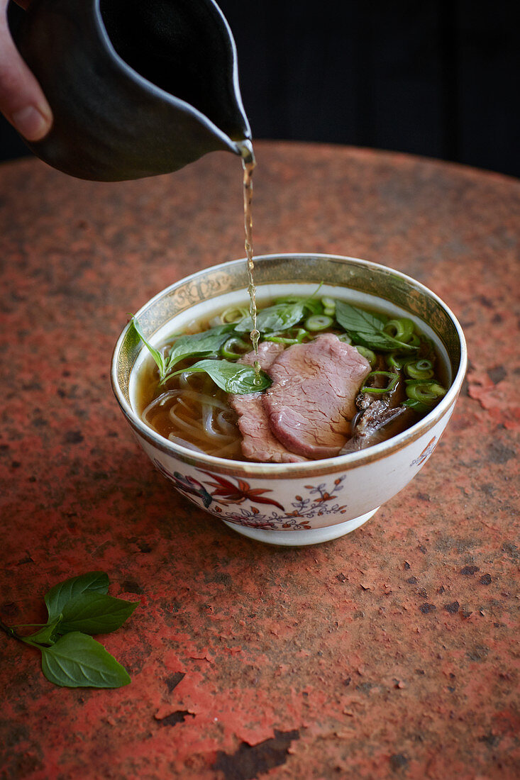 Vietnamese pho with beef and rice noodles