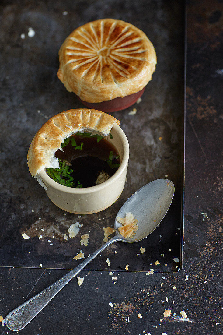 Venison consommé with truffles and a puff pastry topping