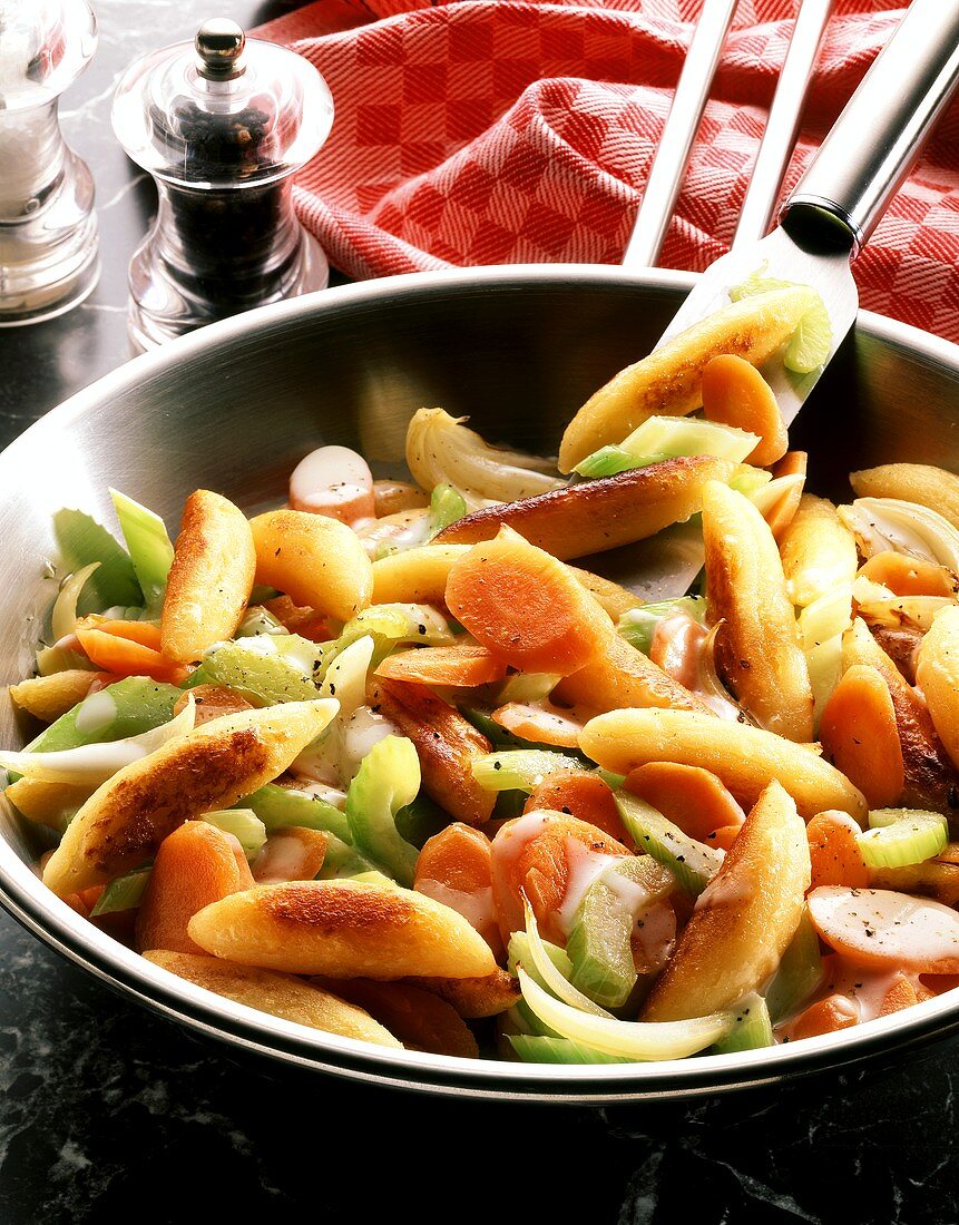 Vegetable pan with carrots, celery and potato noodles