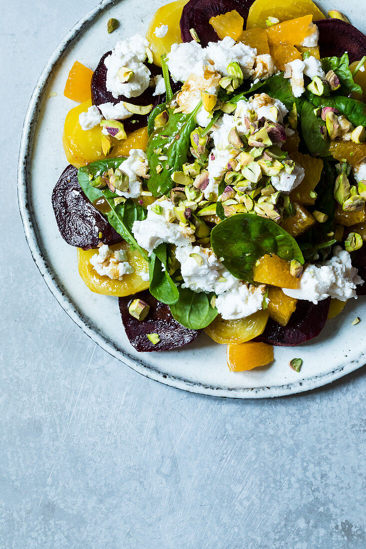 Beetroot and golden beets with goat's cheese and pistachio nuts