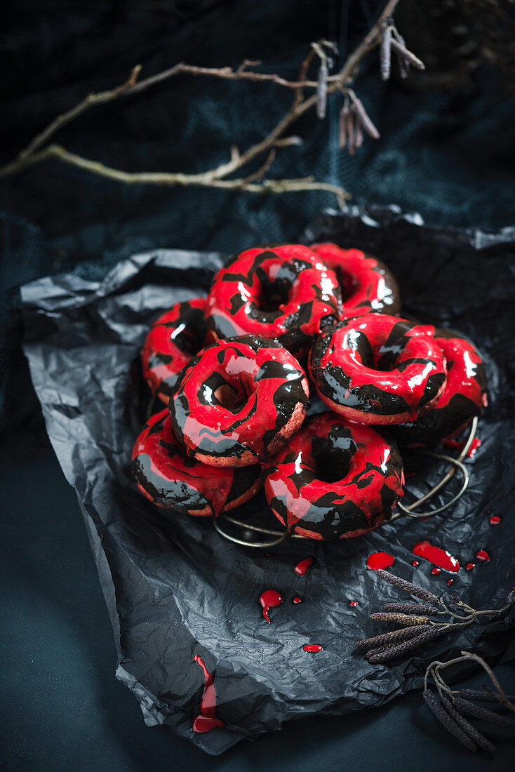 Beetroot donuts with two-tone chocolate icing for Halloween