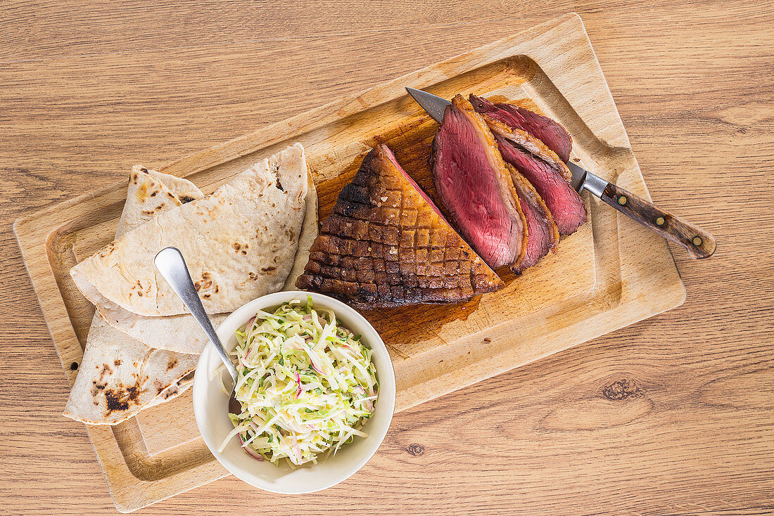 Roast duck breast with coleslaw and tortillas