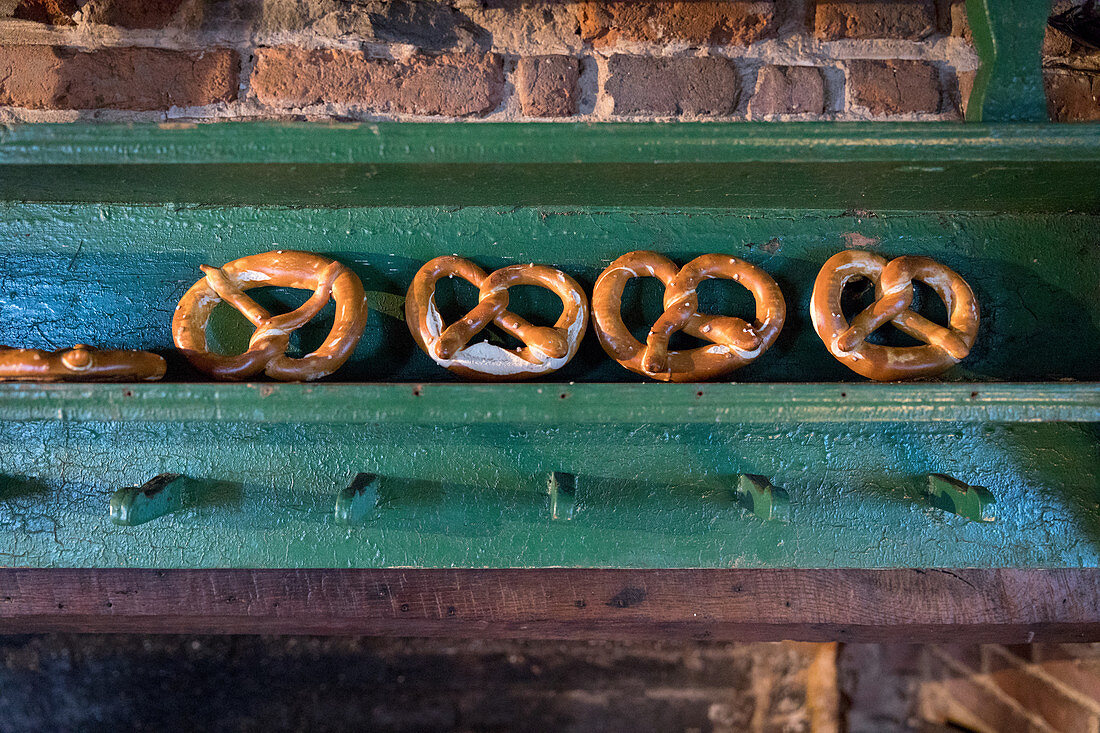 Pretzels arranged along a kitchen shelf