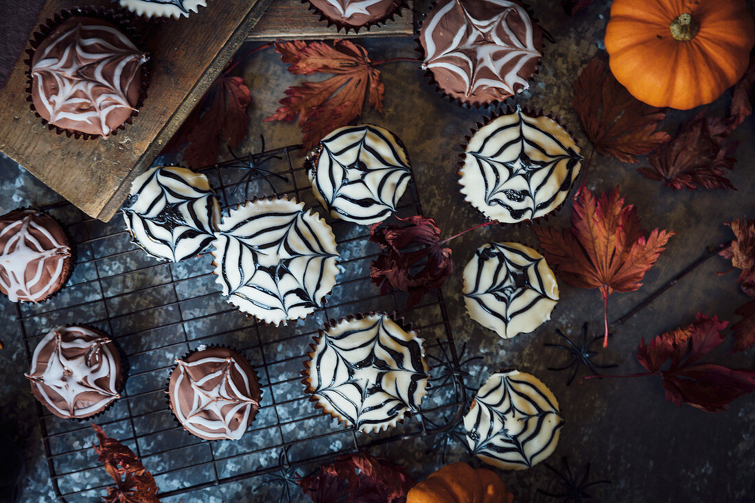 Cobweb cakes for Halloween with mini pumpkins