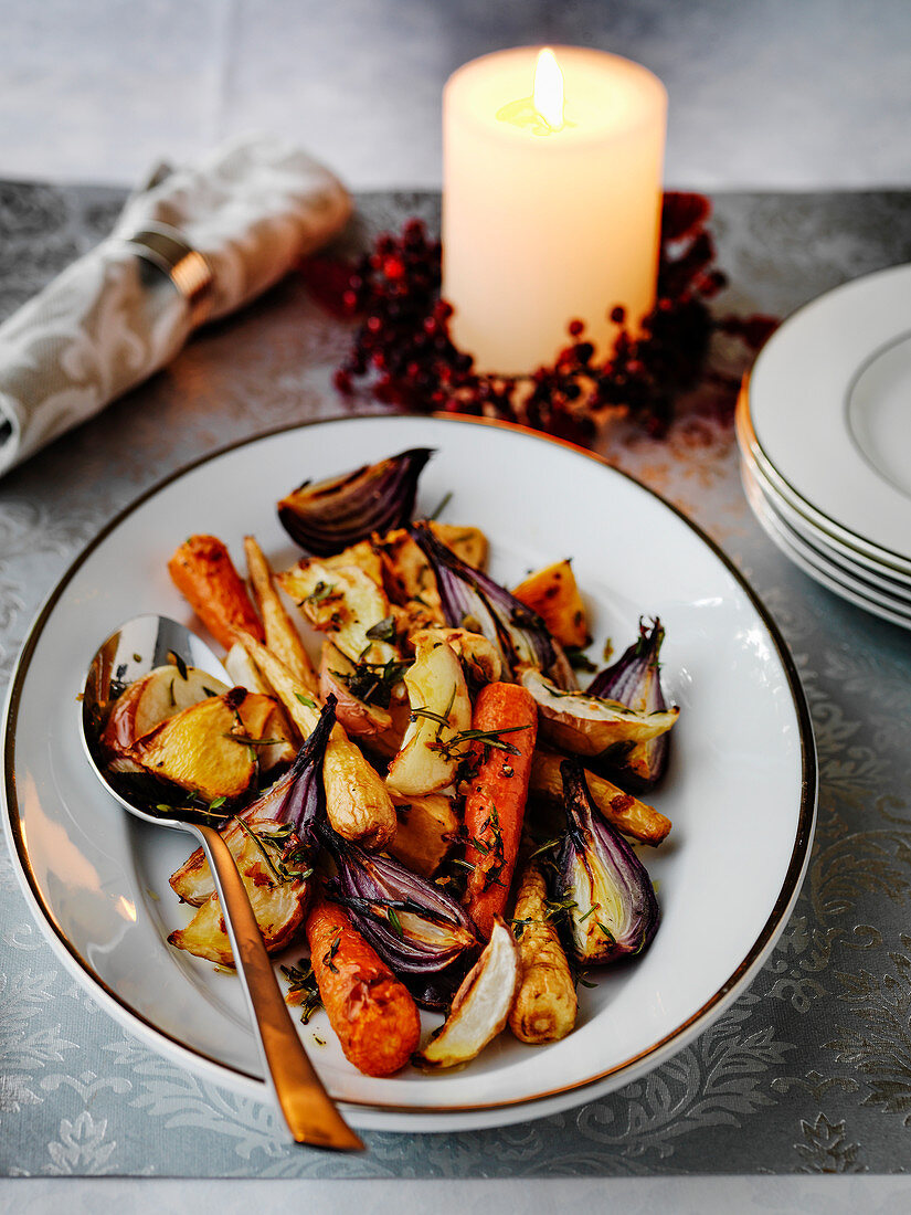Roasted root vegtables for Christmas (carrots, parsnips, red onions, apples and potatoes)