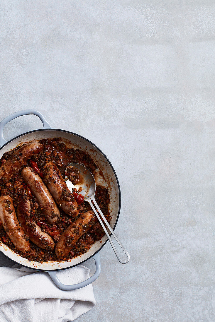 Braised pork and fennel sausages with lentils and rosemary