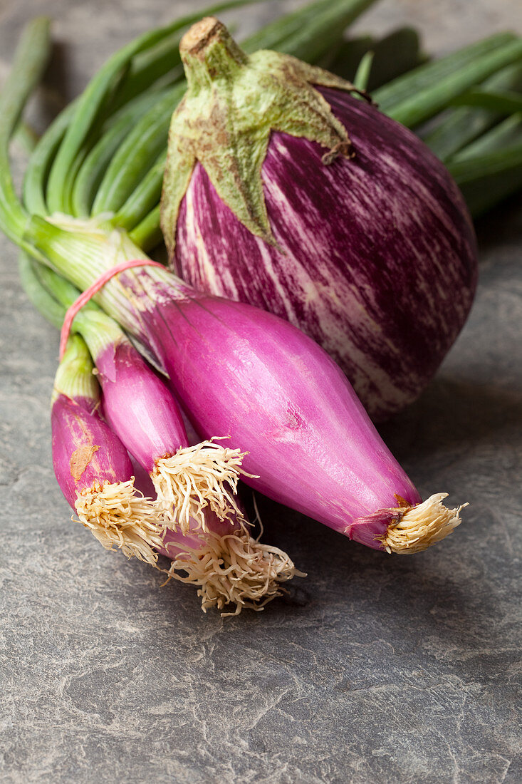 Red spring onions and an eggplant