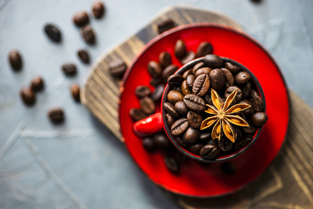 Rustic ceramic cup full of raw coffee beans