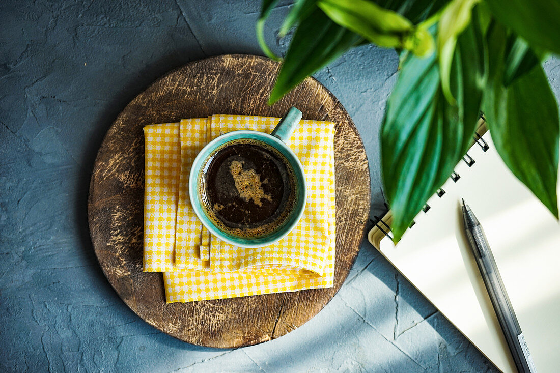 Cup of black coffee on rustic background with copy space