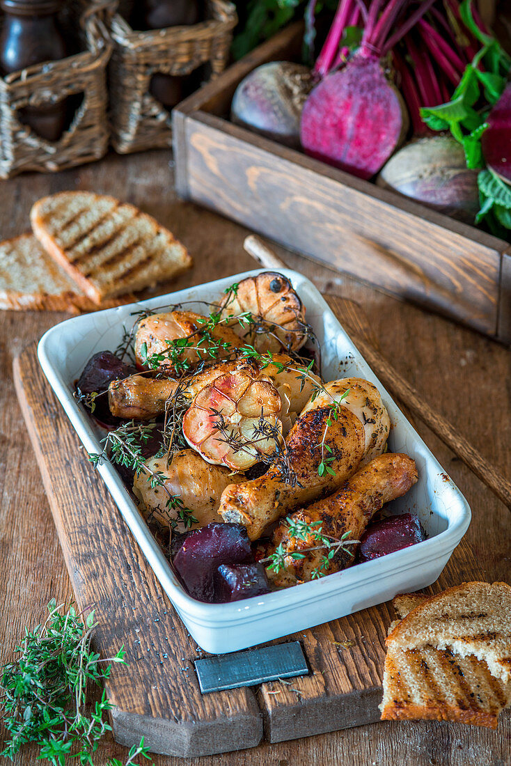 Roast chicken legs with beetroot and thyme