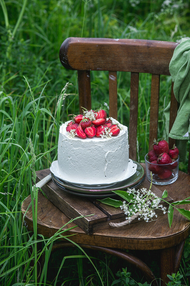 Soaked elderflower syrup sponges, strawberry buttercream cake